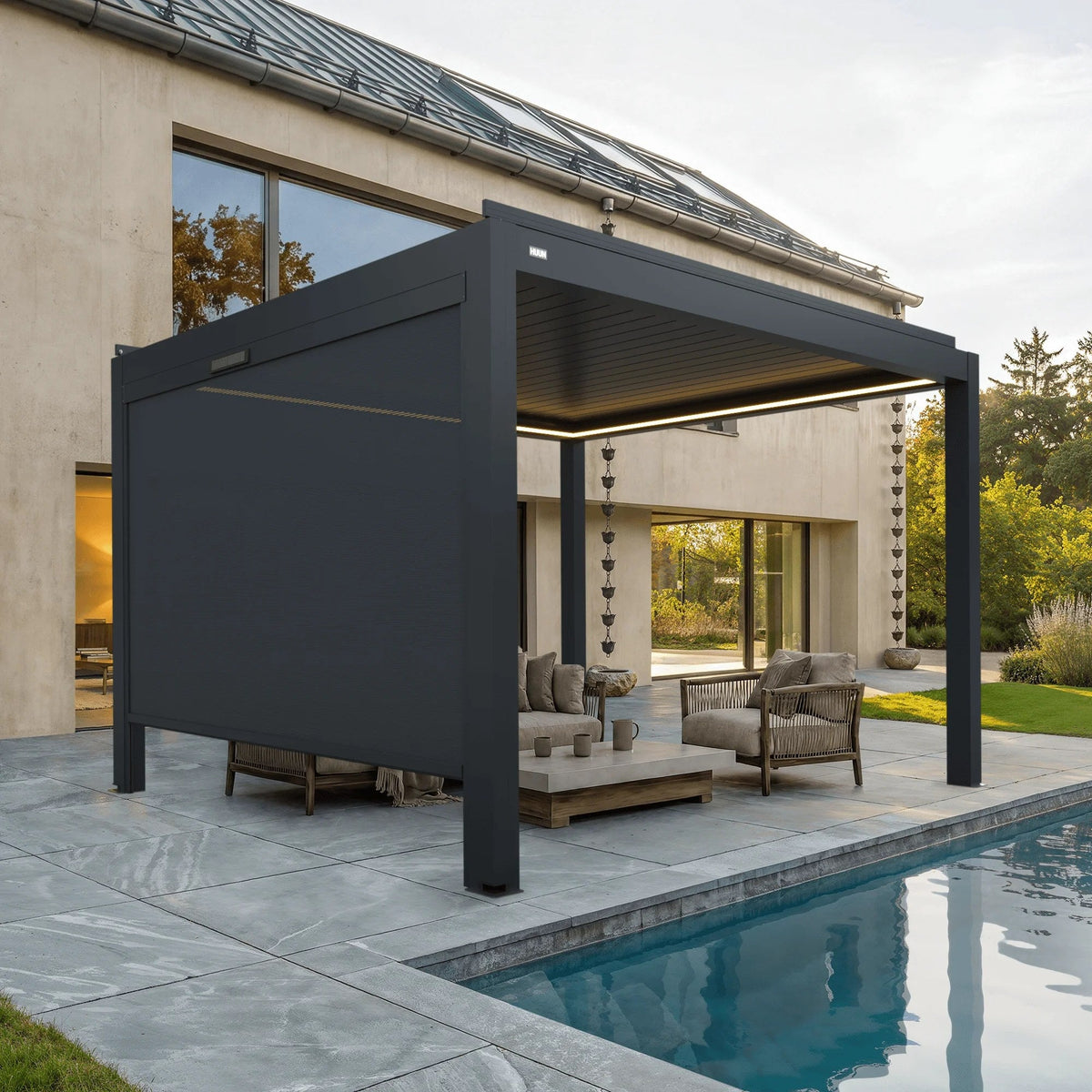 Manual side screen on an Equa louvered pergola beside a pool